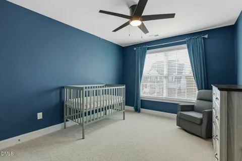 a view of a patio with a table and chairs