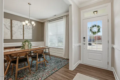 a view of a dining room with furniture and window