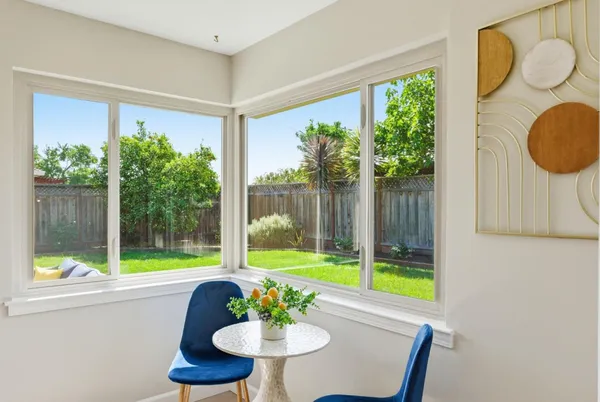 a view of a dining room with furniture window and outside view