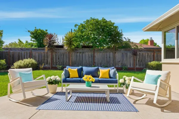 a view of patio with furniture