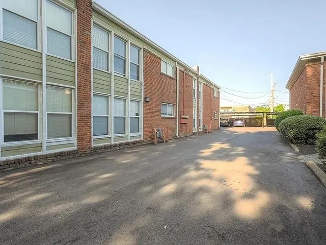 a view of a house with a street
