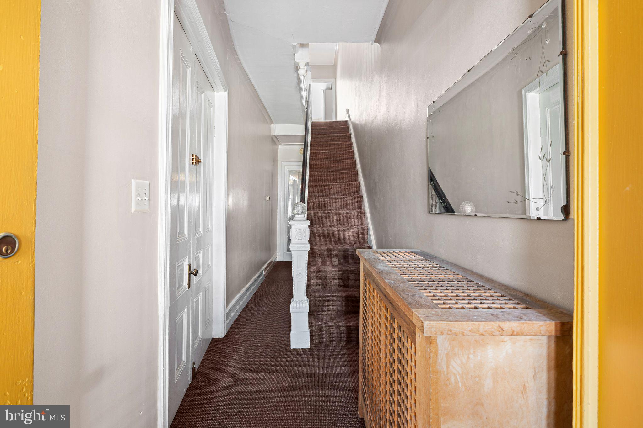 2324 Poplar Street, Unit 2F Philadelphia, PA 19130 - Photo 17 of 17 a bathroom with a granite countertop sink and a mirror