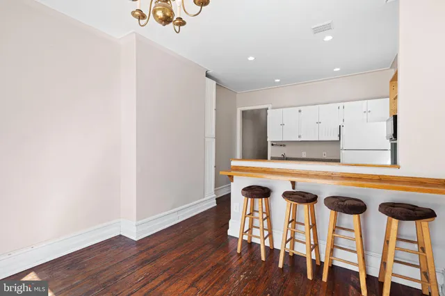 a kitchen with a table and chairs