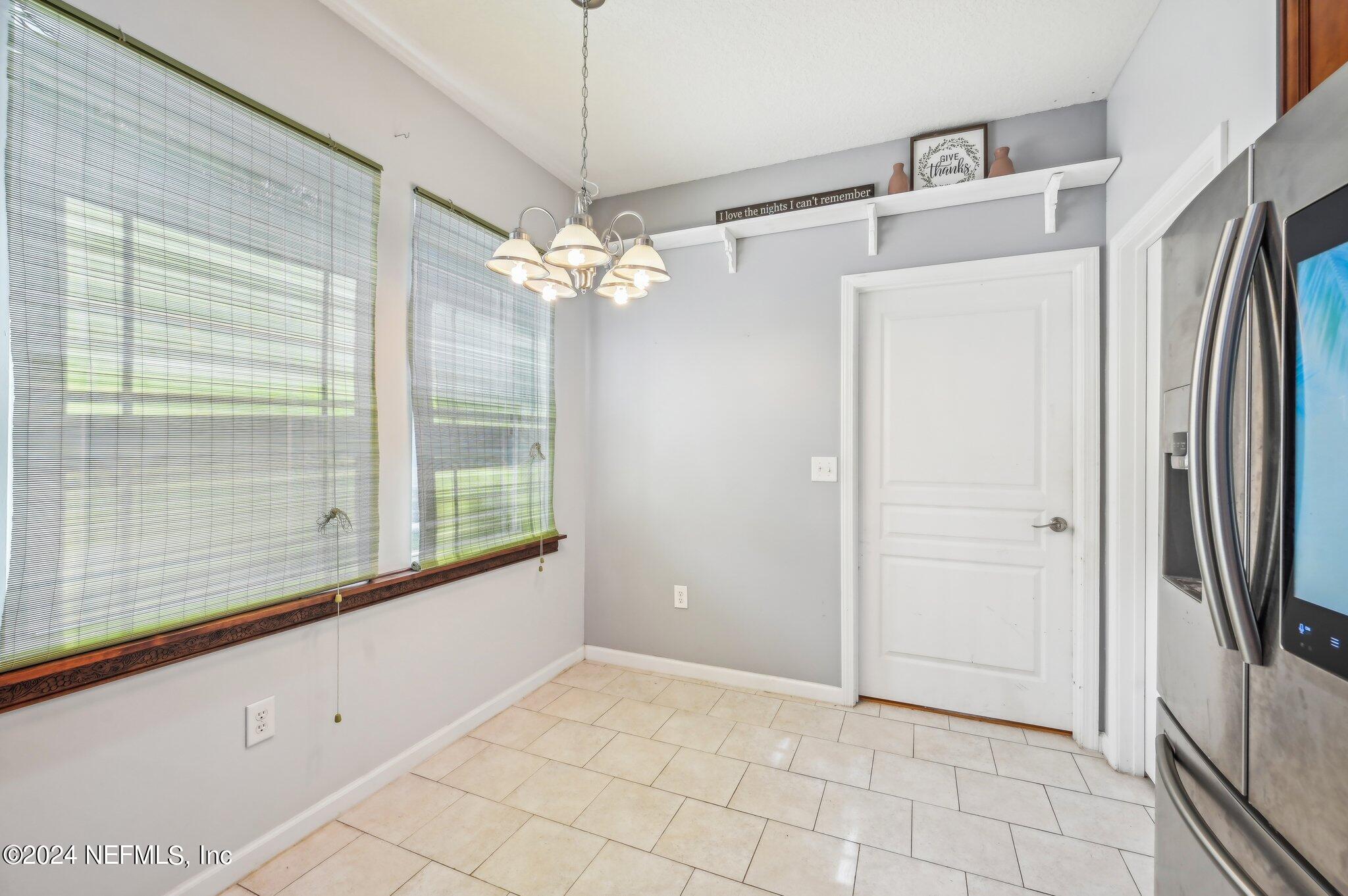 4253 Dalry Drive Jacksonville, FL 32246 - Photo 12 of 40 a view of a kitchen with a dishwasher and a refrigerator
