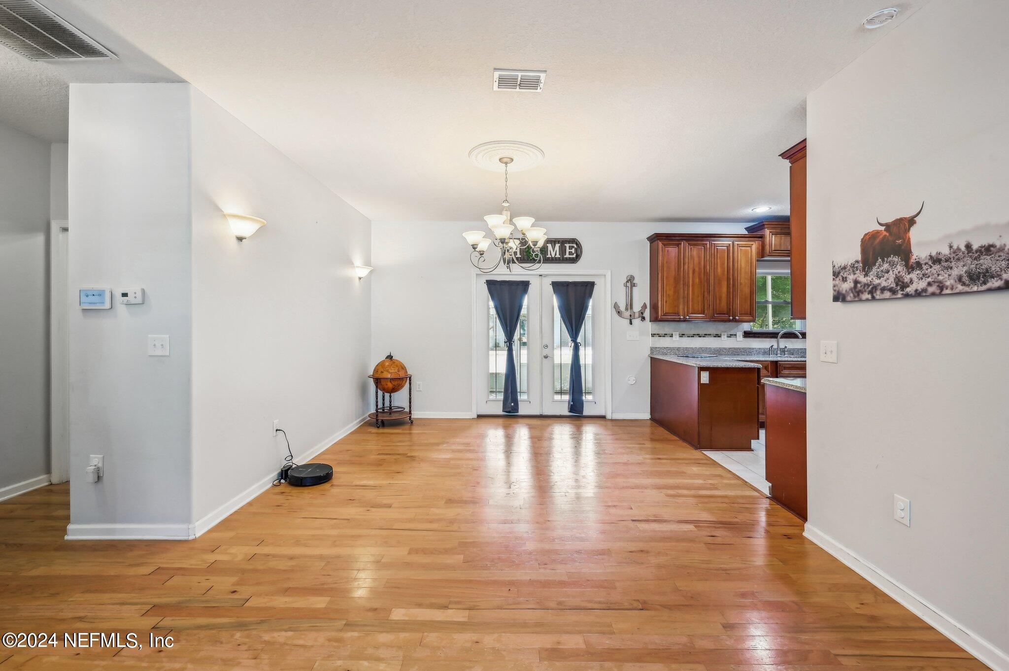 4253 Dalry Drive Jacksonville, FL 32246 - Photo 25 of 40 a view of kitchen with furniture and wooden floor