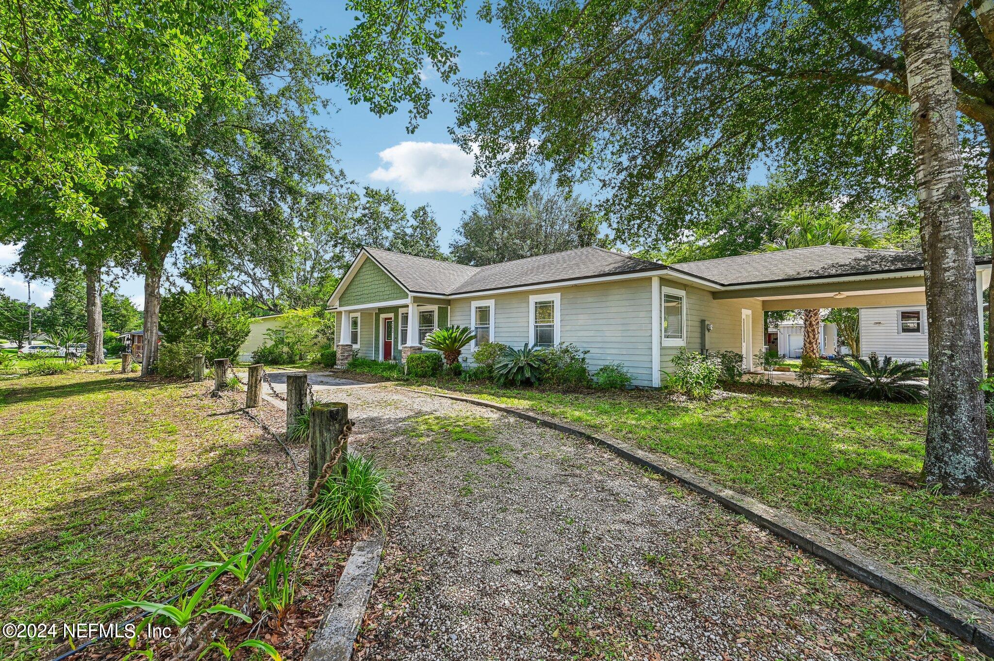 4253 Dalry Drive Jacksonville, FL 32246 - Photo 3 of 40 a view of house with backyard and a garden