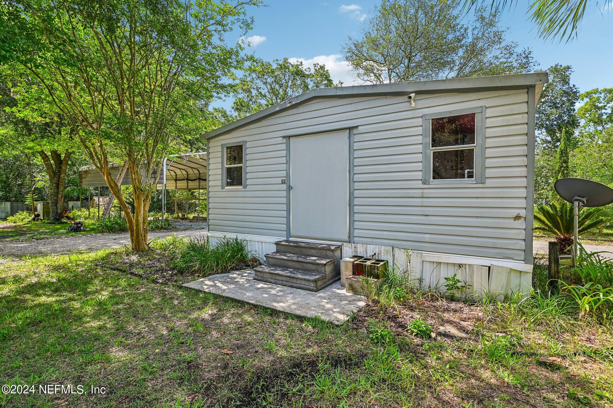 4253 Dalry Drive Jacksonville, FL 32246 - Photo 33 of 40 a view of a house with a yard