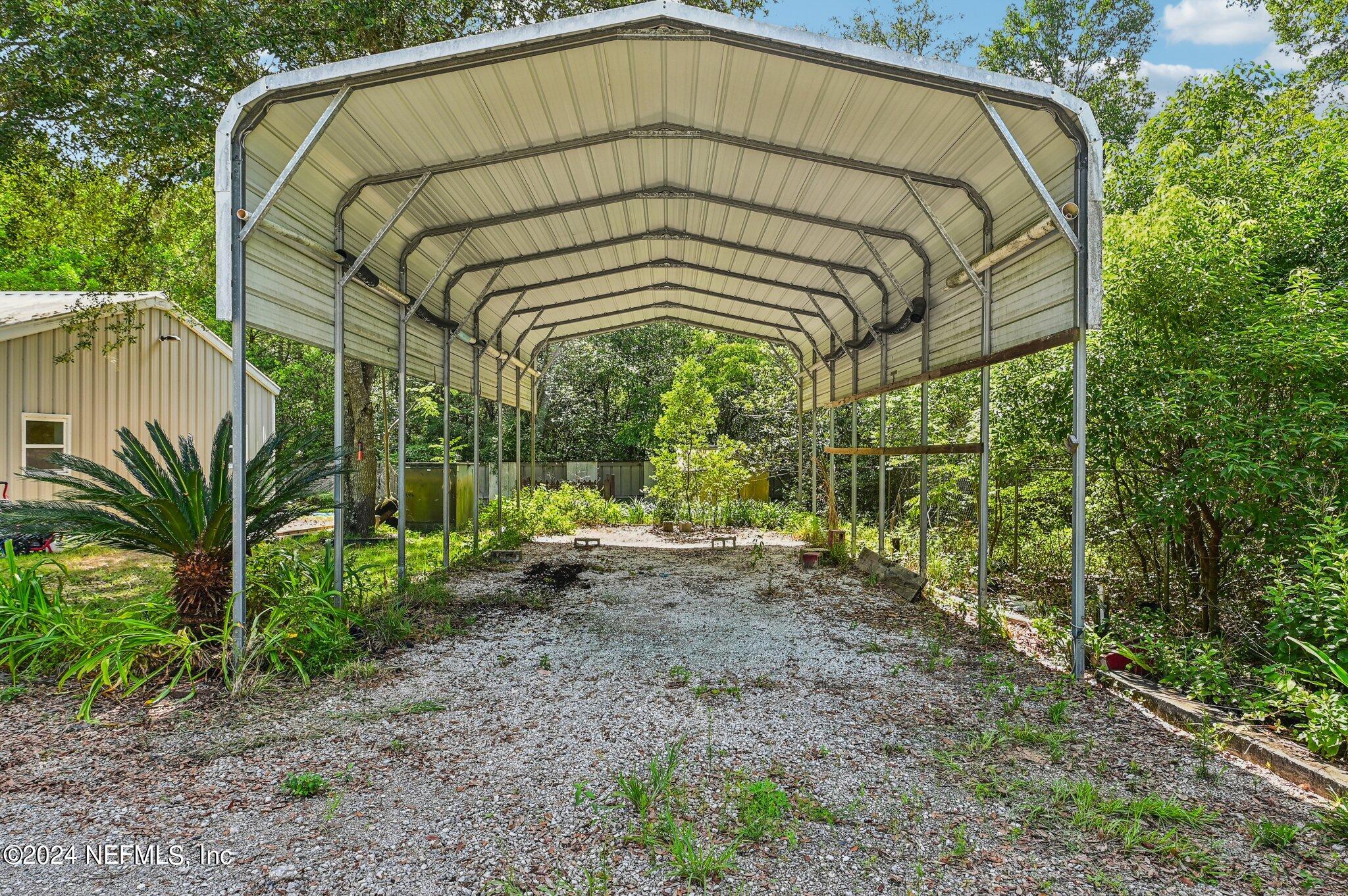 4253 Dalry Drive Jacksonville, FL 32246 - Photo 35 of 40 a blue and white house with a yard
