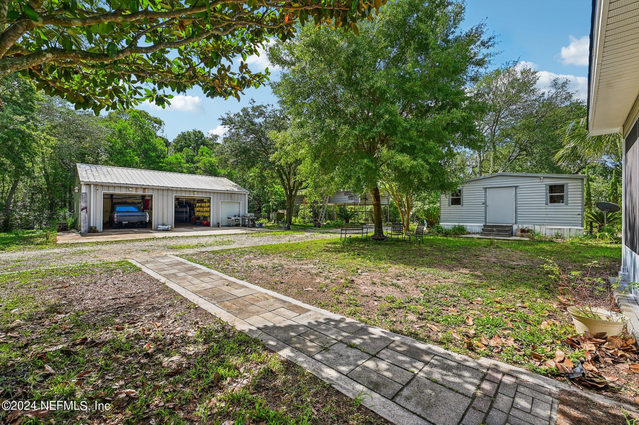 4253 Dalry Drive Jacksonville, FL 32246 - Photo 38 of 40 a house with lots of trees