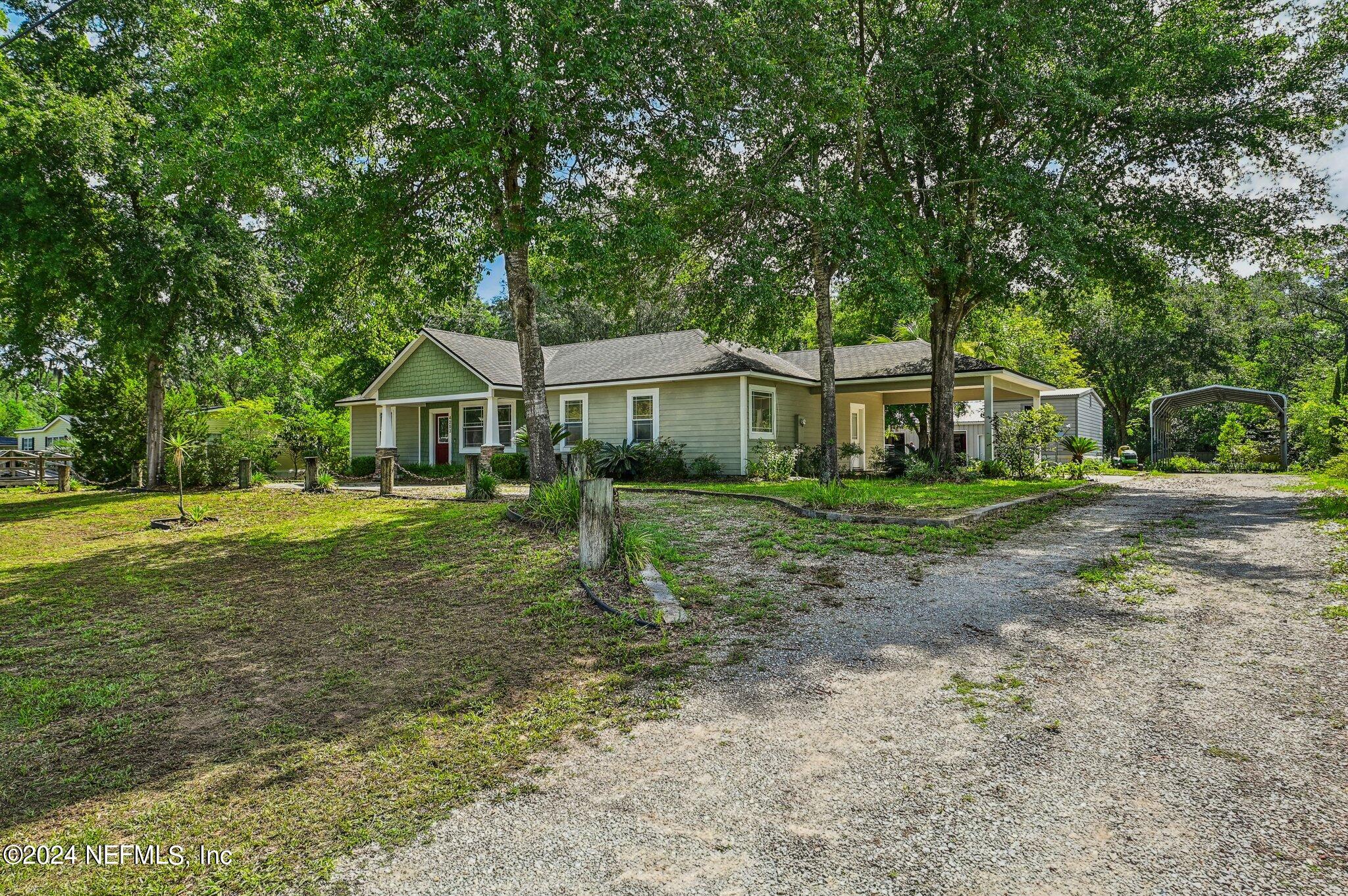 4253 Dalry Drive Jacksonville, FL 32246 - Photo 4 of 40 a front view of a house with a yard