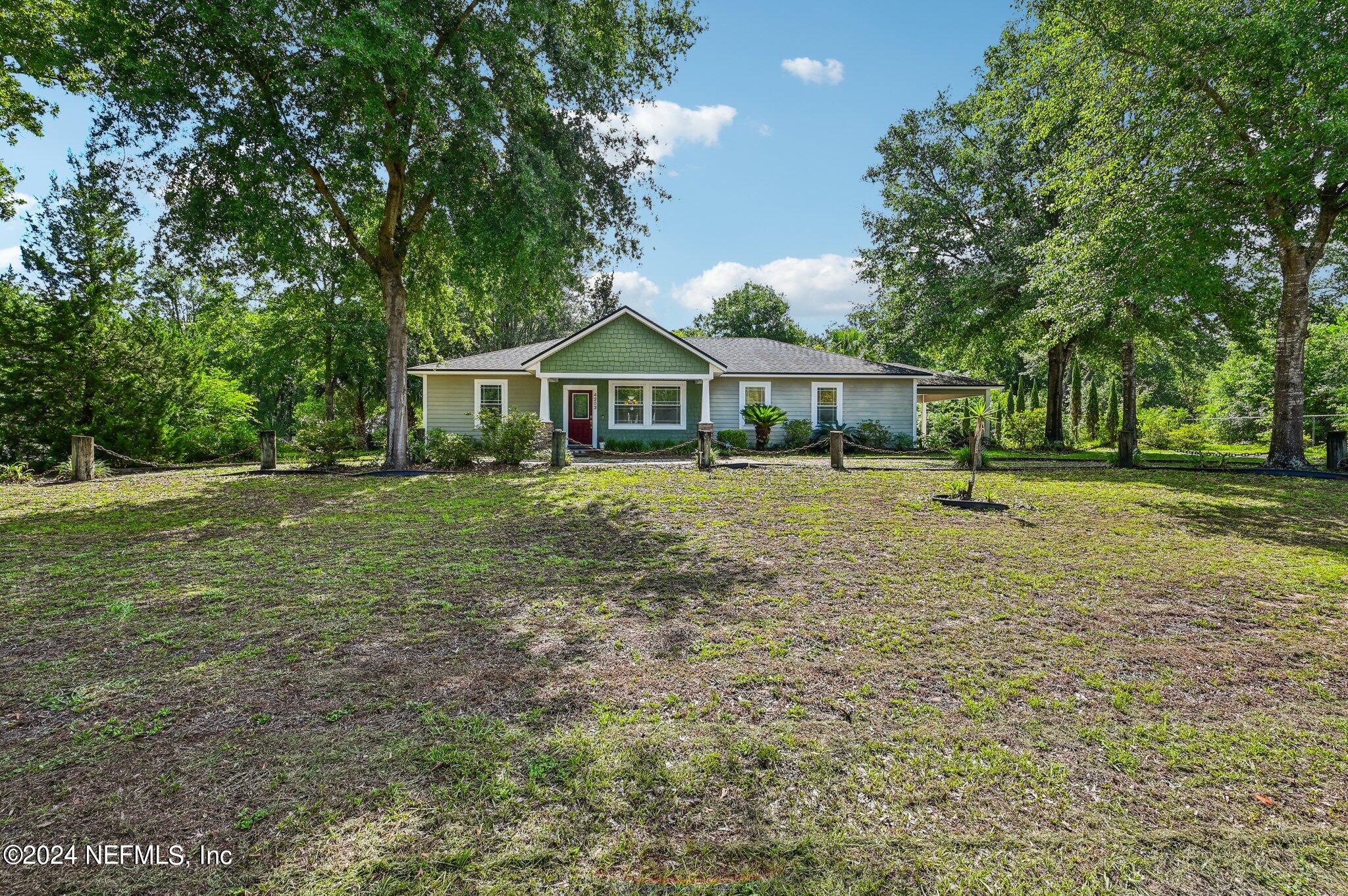 4253 Dalry Drive Jacksonville, FL 32246 - Photo 5 of 40 a front view of a house with a yard