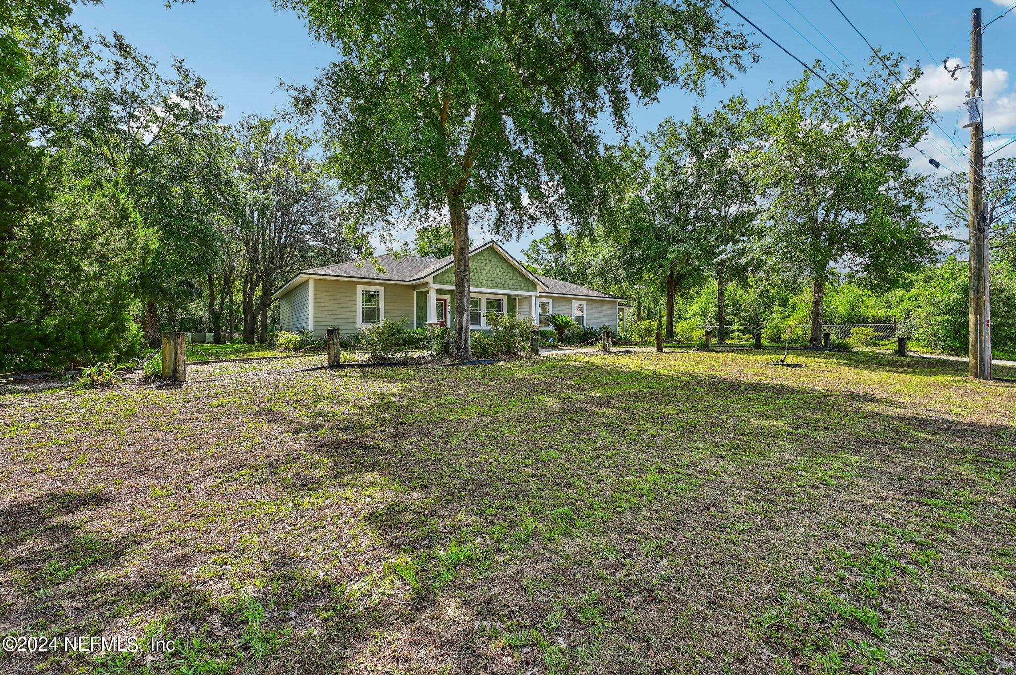 4253 Dalry Drive Jacksonville, FL 32246 - Photo 6 of 40 a front view of a house with a yard