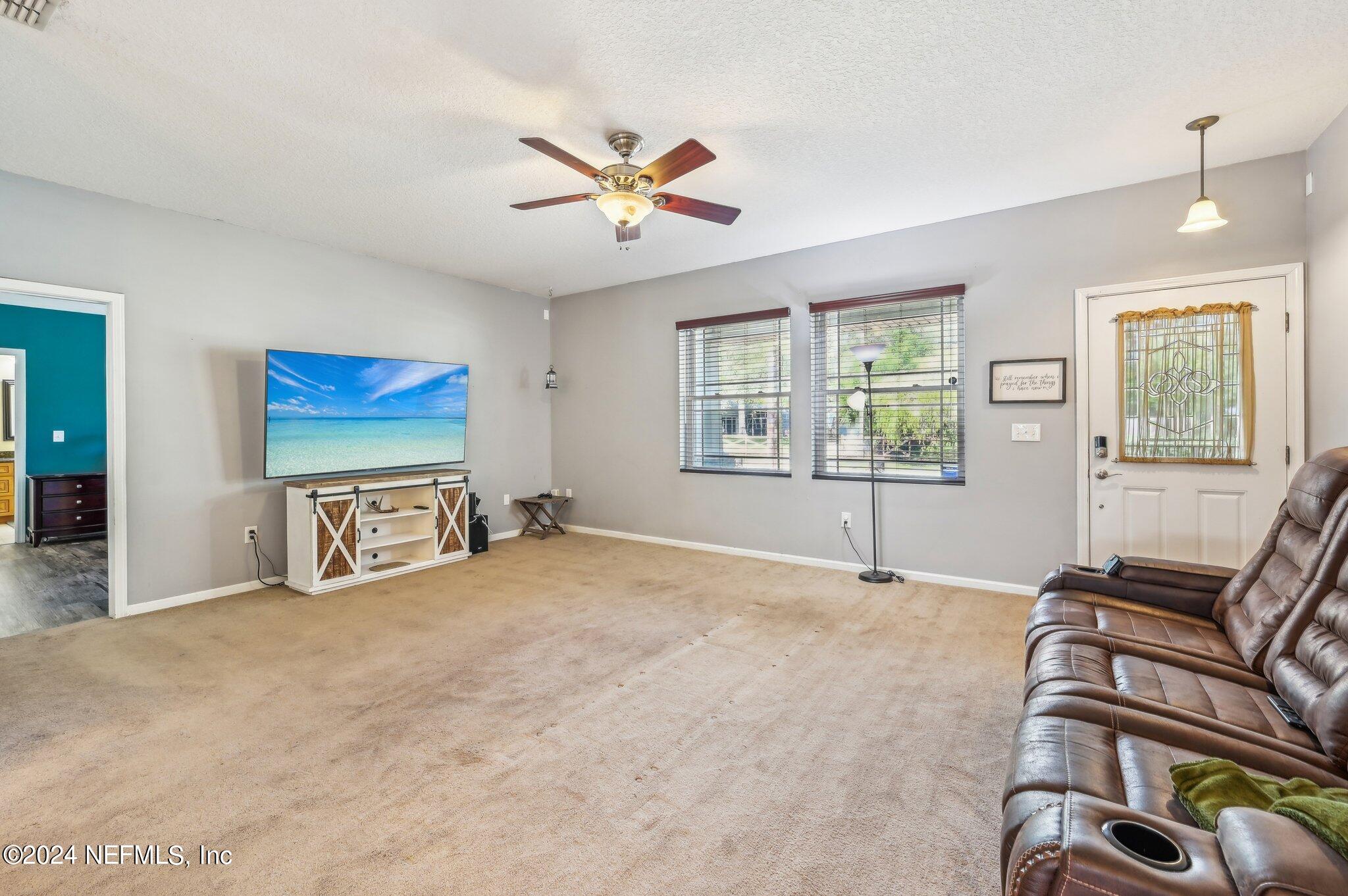 4253 Dalry Drive Jacksonville, FL 32246 - Photo 8 of 40 a view of a livingroom with a workspace