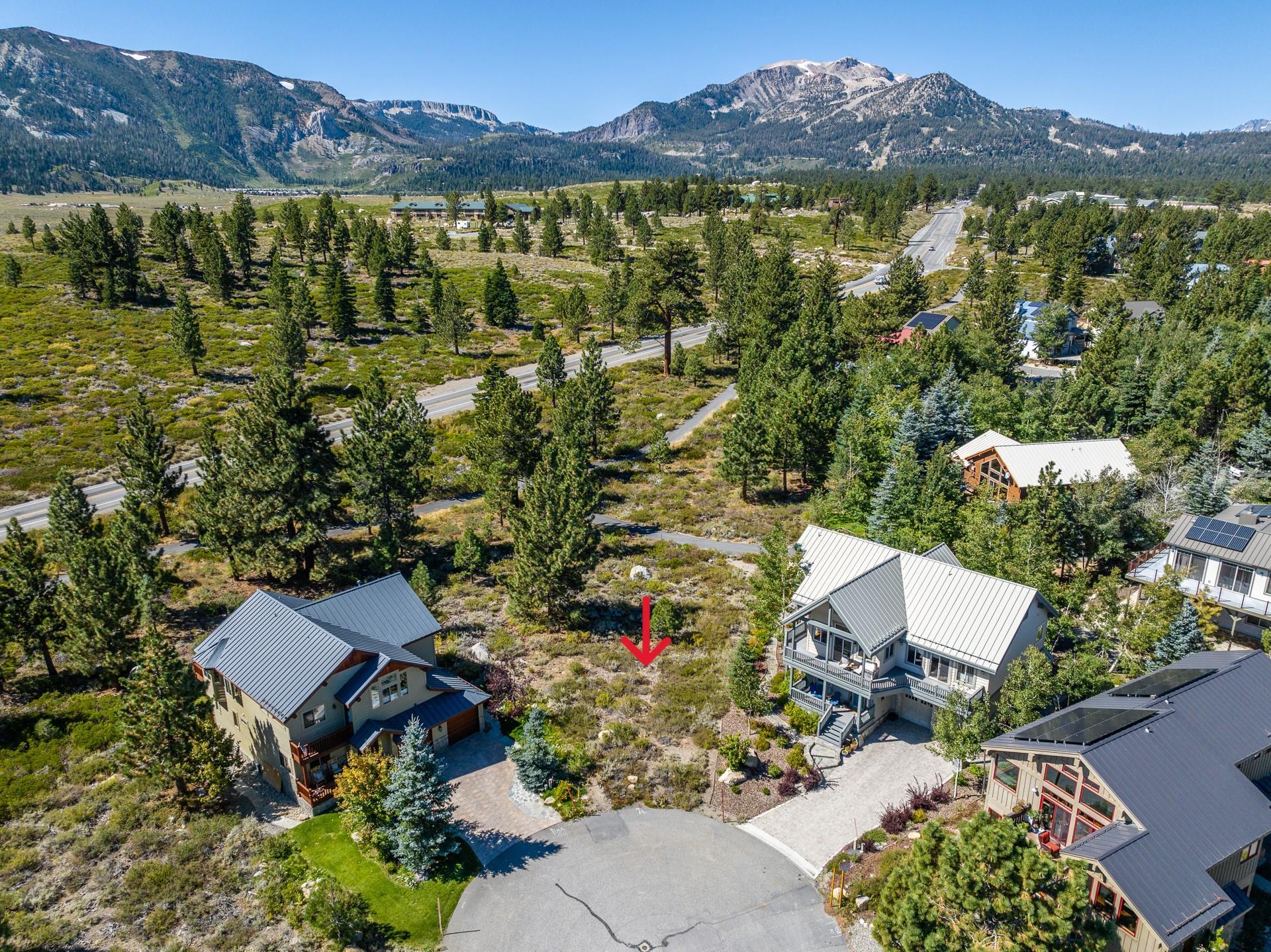an aerial view of residential house with outdoor space and mountain view