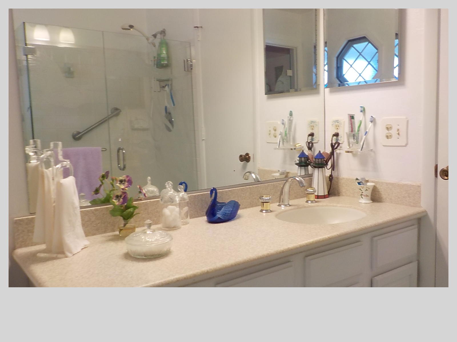 2159 Southeast Erwin Road Port St. Lucie, FL 34952 - Photo 23 of 48 a bathroom with a sink double vanity and a mirror