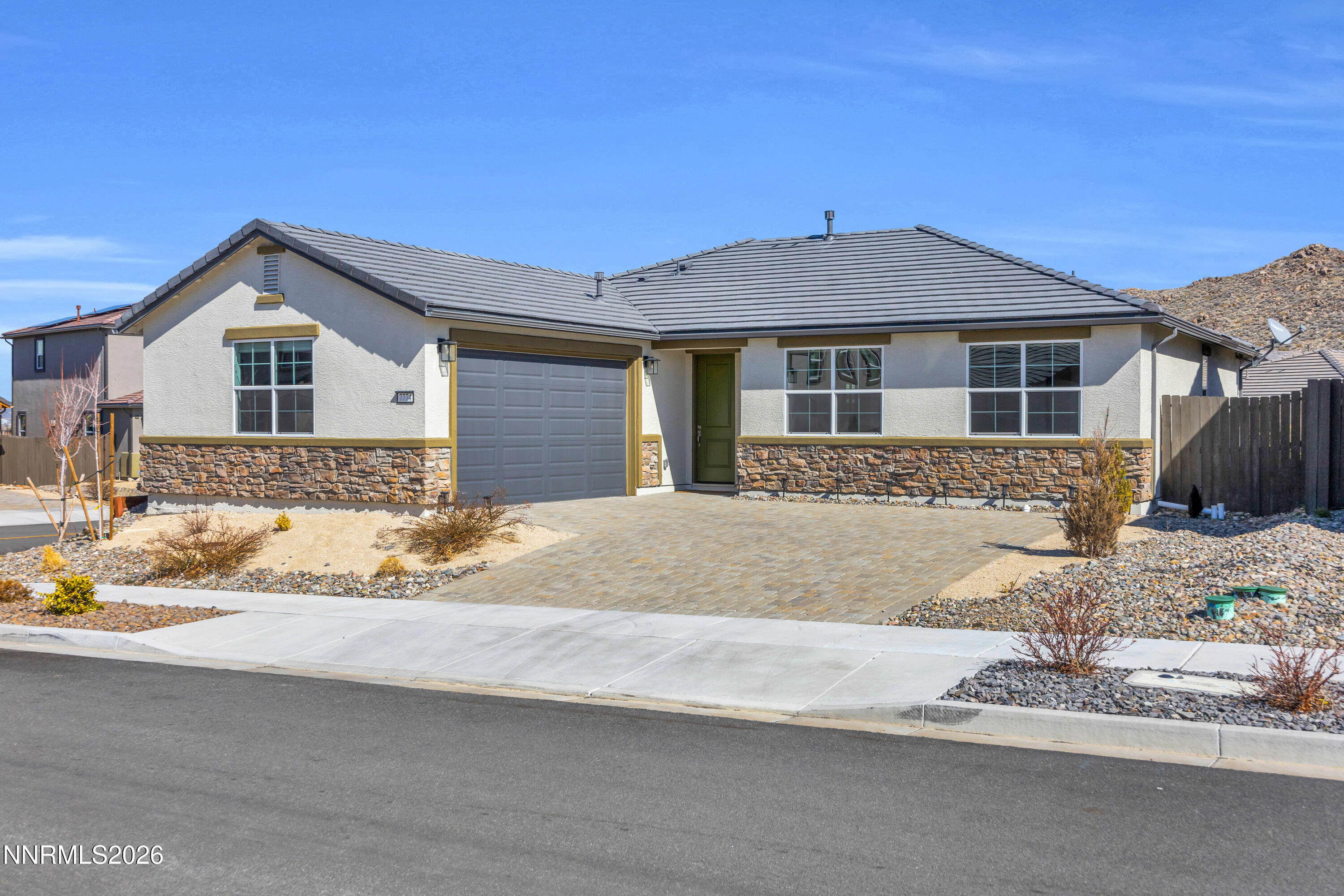 7774 Enclave Key Road Reno, NV 89506 - Photo 1 of 26 a front view of a house with a yard