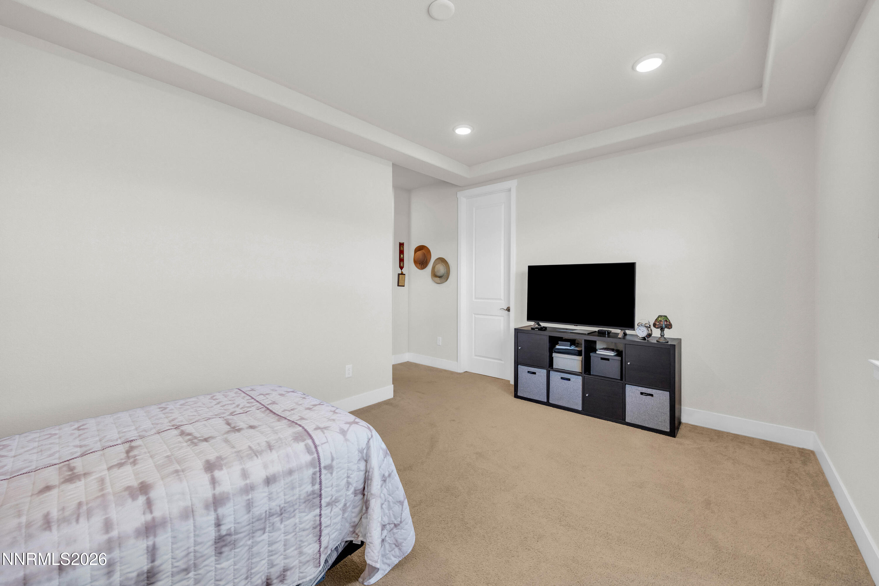 7774 Enclave Key Road Reno, NV 89506 - Photo 12 of 26 a bedroom with a bed and a television in it
