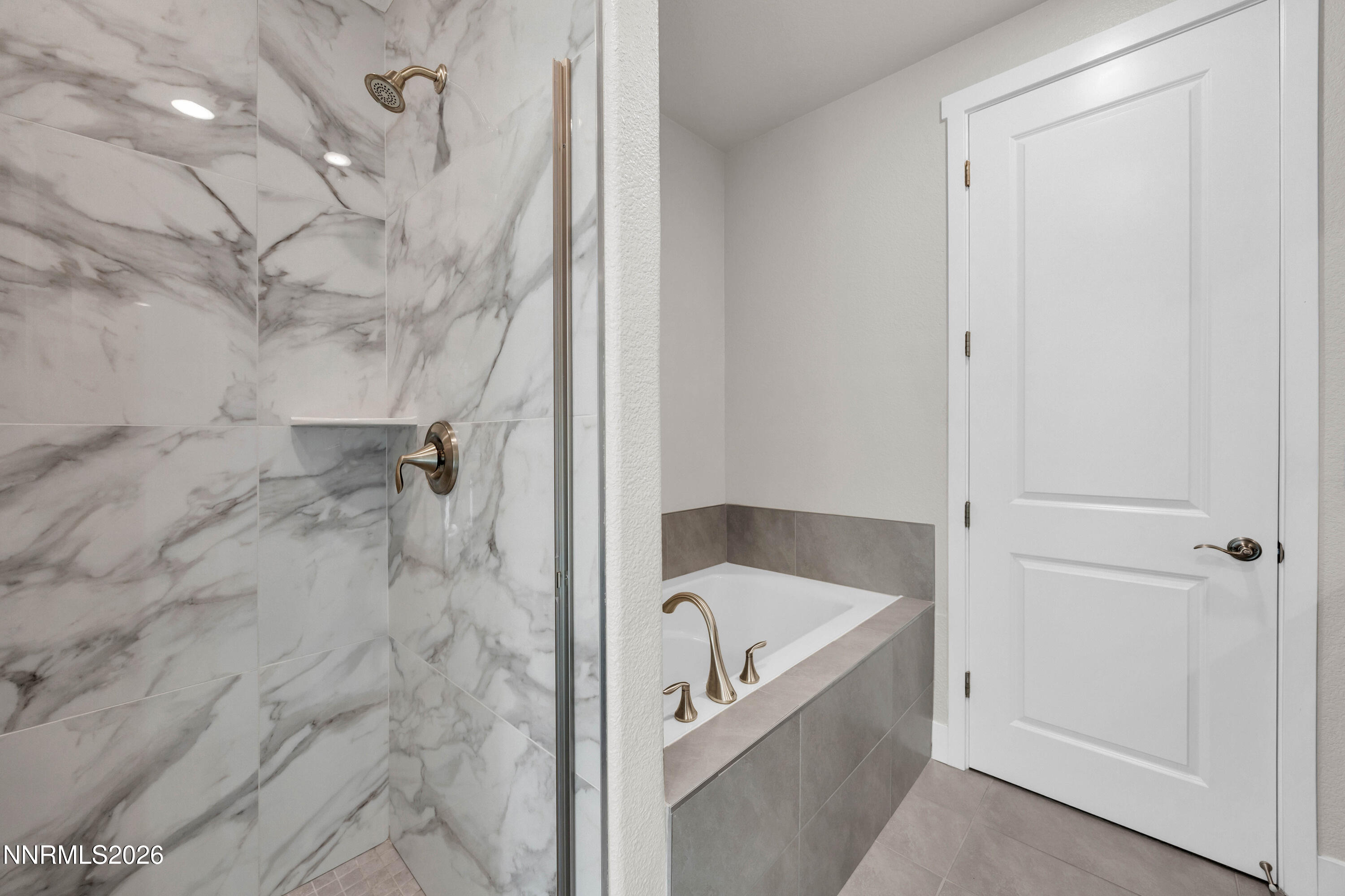 7774 Enclave Key Road Reno, NV 89506 - Photo 14 of 26 a bathroom with a bathtub