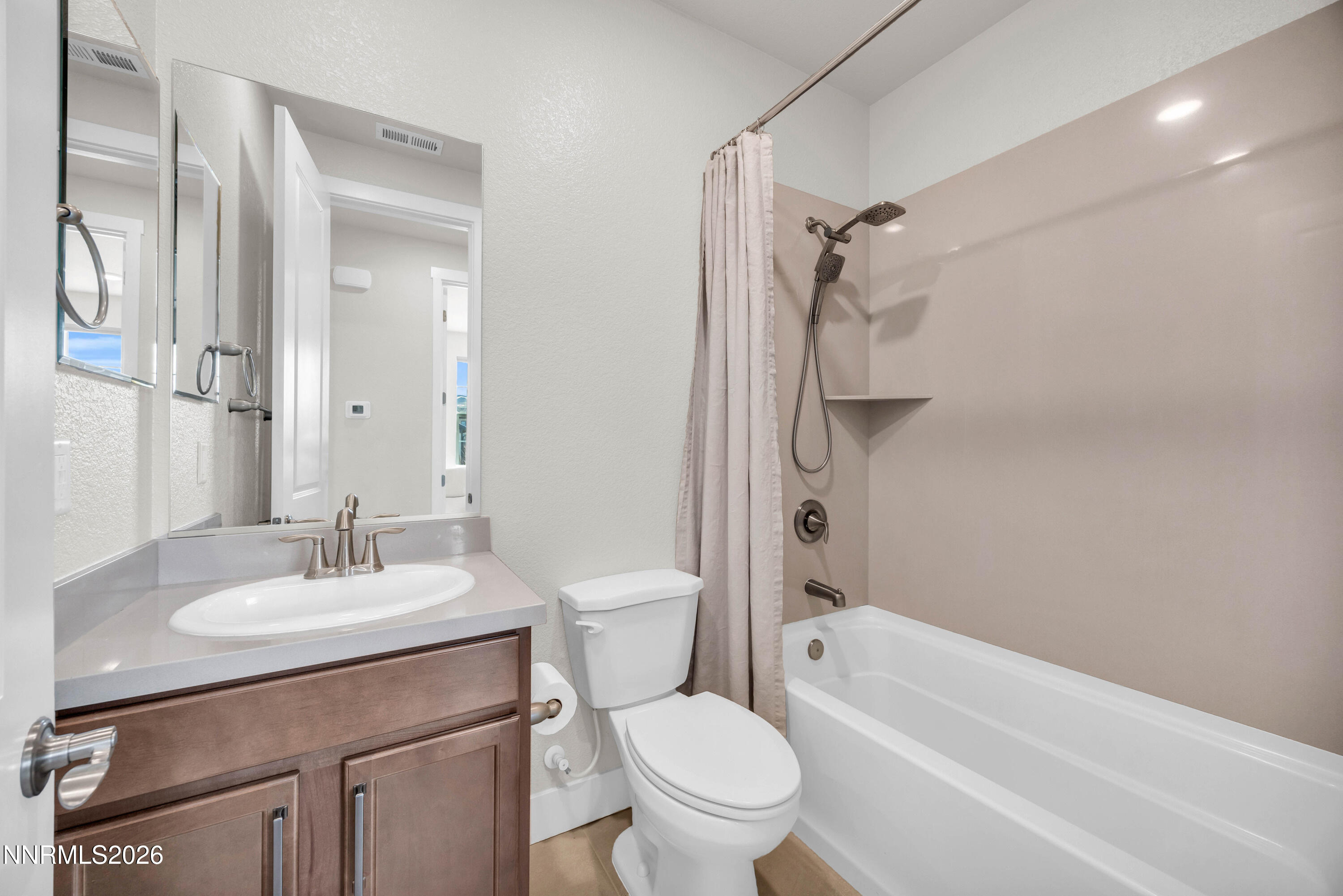 7774 Enclave Key Road Reno, NV 89506 - Photo 18 of 26 a bathroom with a sink toilet and shower