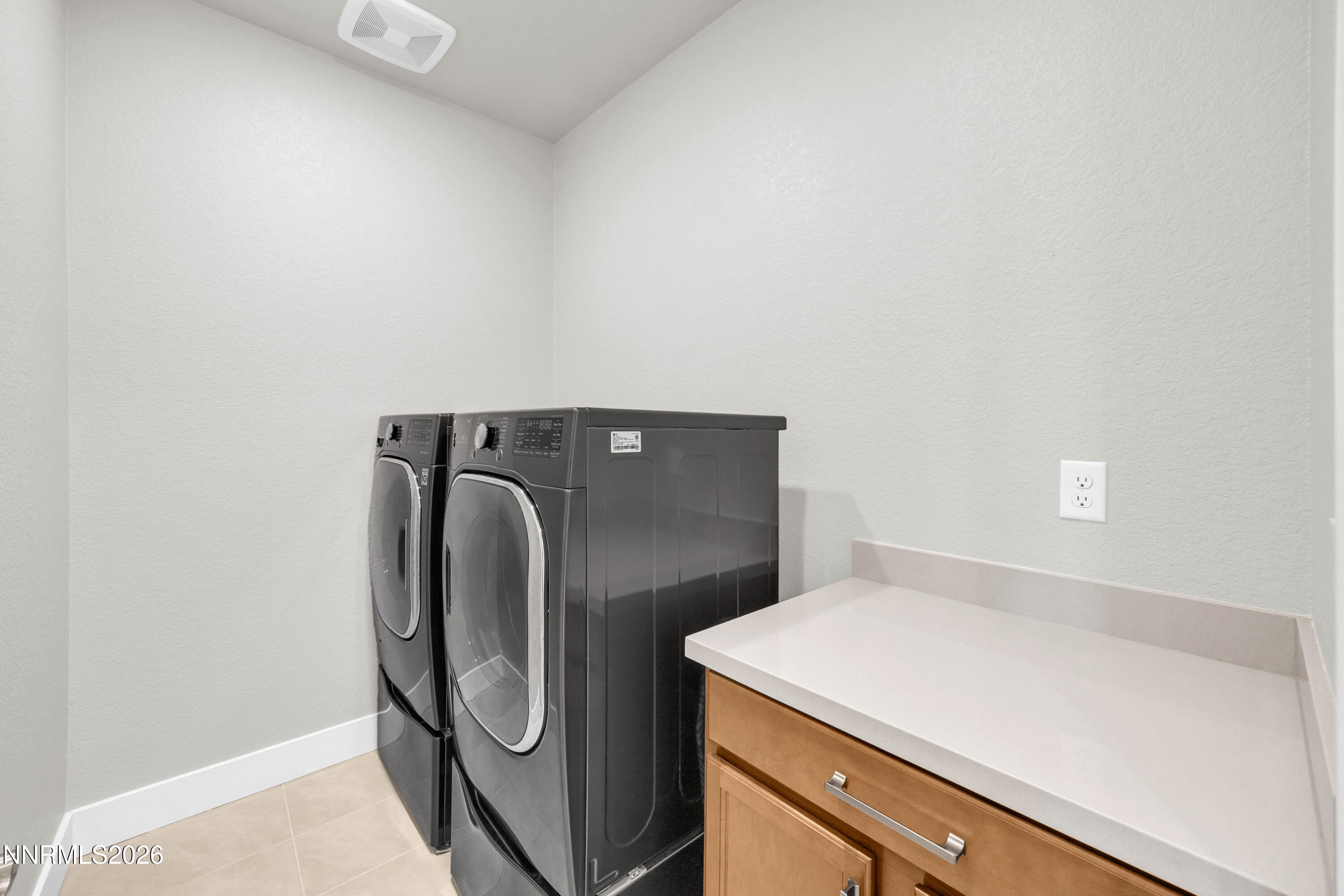 7774 Enclave Key Road Reno, NV 89506 - Photo 19 of 26 a utility room with dryer and washer