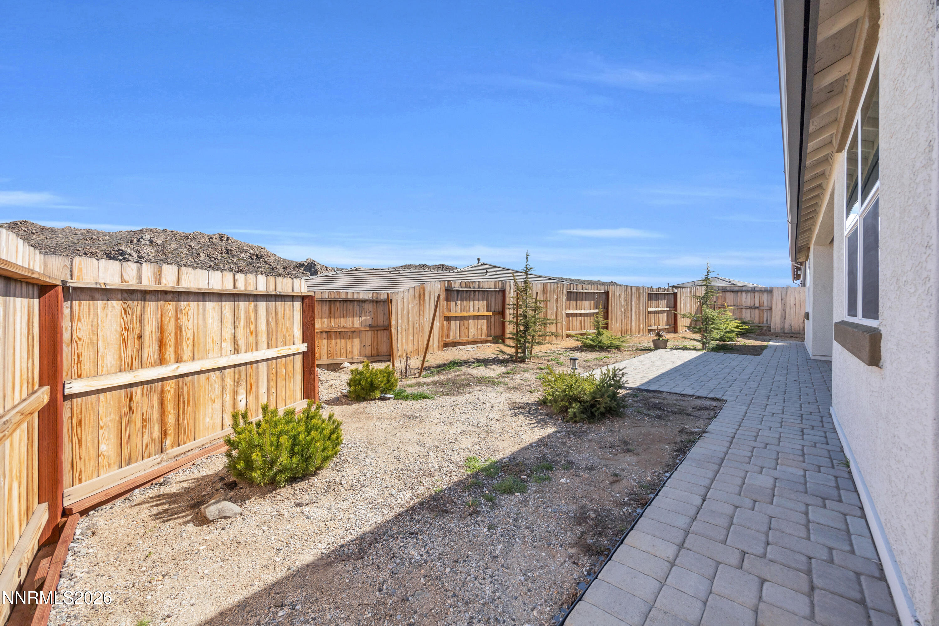 7774 Enclave Key Road Reno, NV 89506 - Photo 20 of 26 a view of a pathway with a house in the background