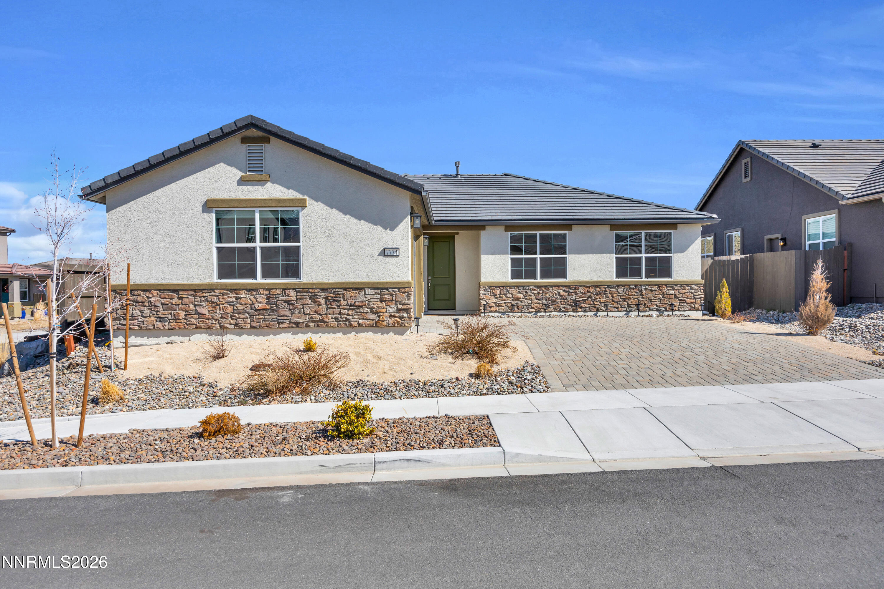 7774 Enclave Key Road Reno, NV 89506 - Photo 2 of 26 a front view of a house with a yard