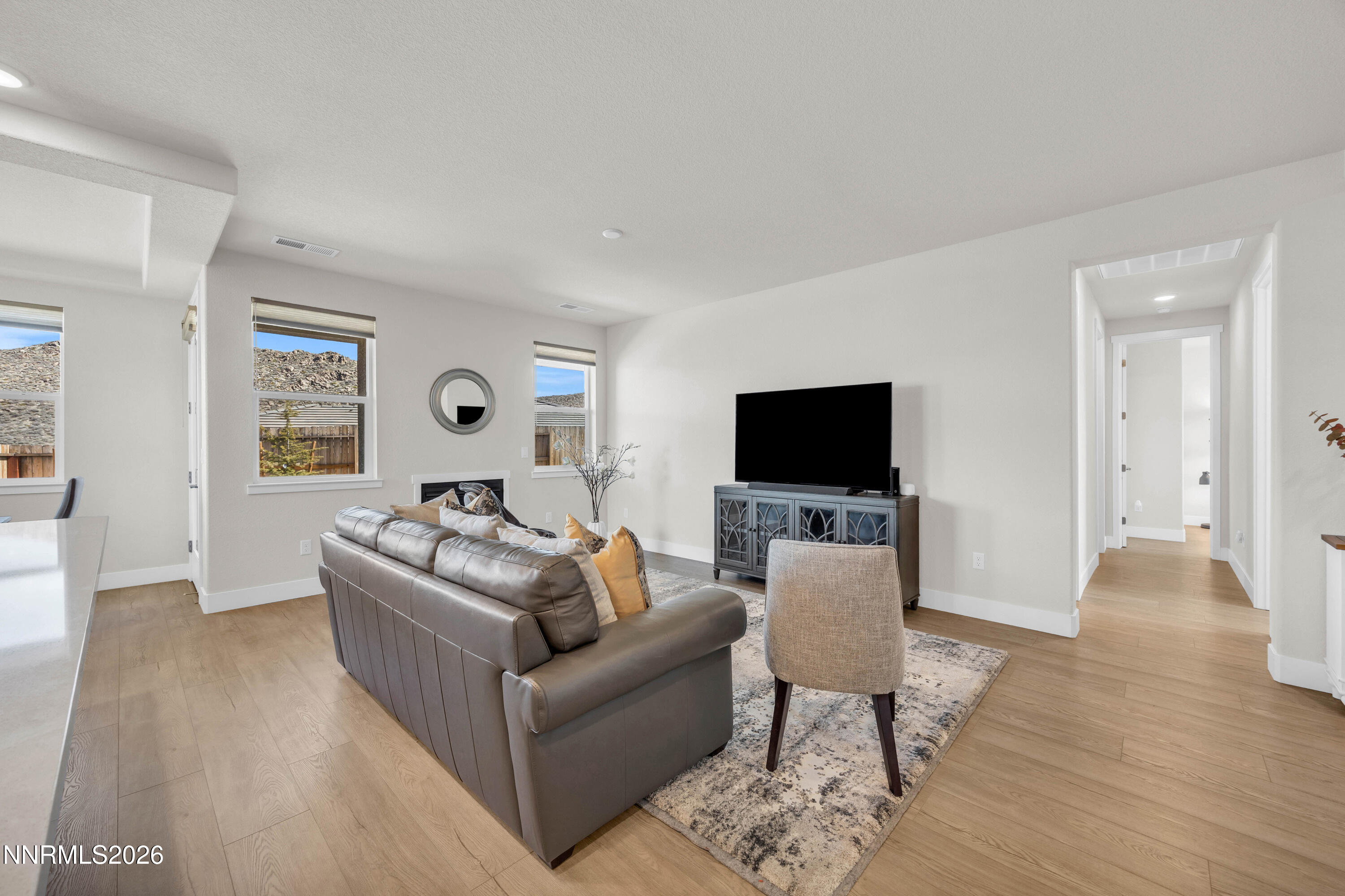 7774 Enclave Key Road Reno, NV 89506 - Photo 5 of 26 a living room with furniture and a flat screen tv