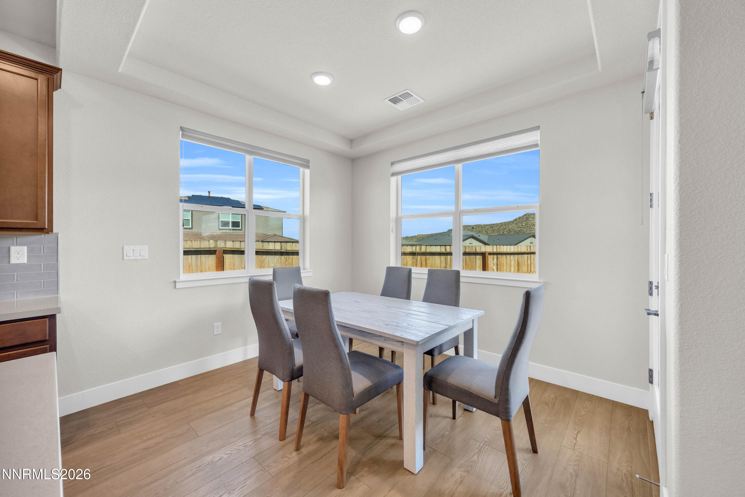 7774 Enclave Key Road Reno, NV 89506 - Photo 10 of 26 a view of a dining room with furniture window and outside view