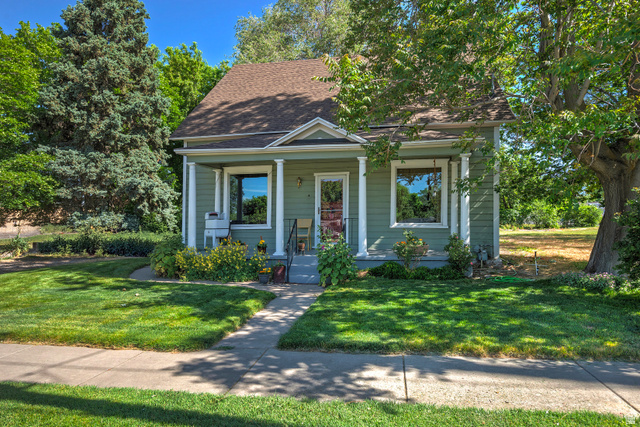 178 17th Street Ogden, UT 84404 - Photo 28 of 29 Charming single-story home featuring a covered front porch with white columns, a pitched roof, and light green siding
