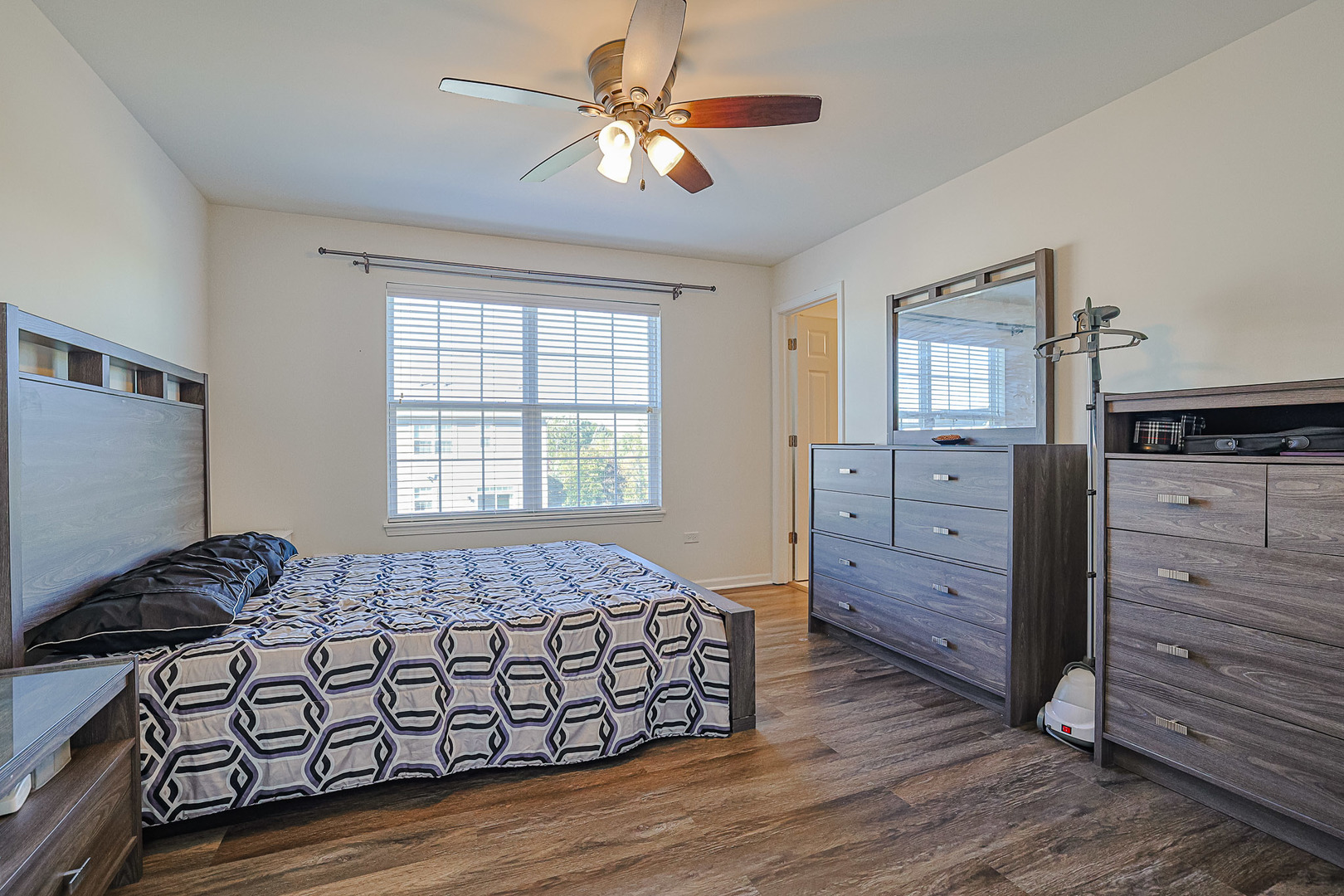 299 Bennett Drive Carol Stream, IL 60188 - Photo 16 of 27 a bedroom with a bed and a dresser