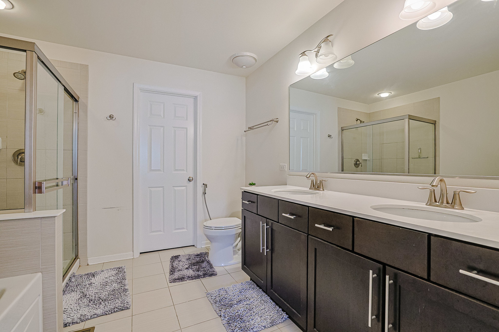 299 Bennett Drive Carol Stream, IL 60188 - Photo 24 of 27 a bathroom with a sink toilet and shower