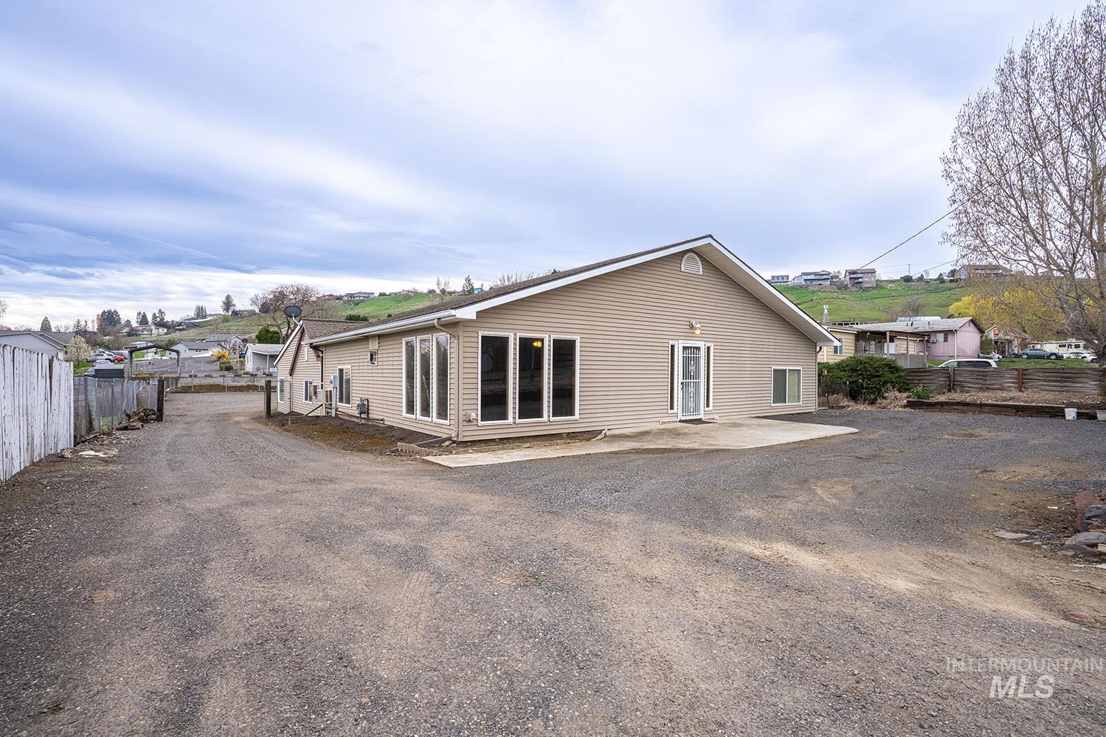 View of side of home with a patio area