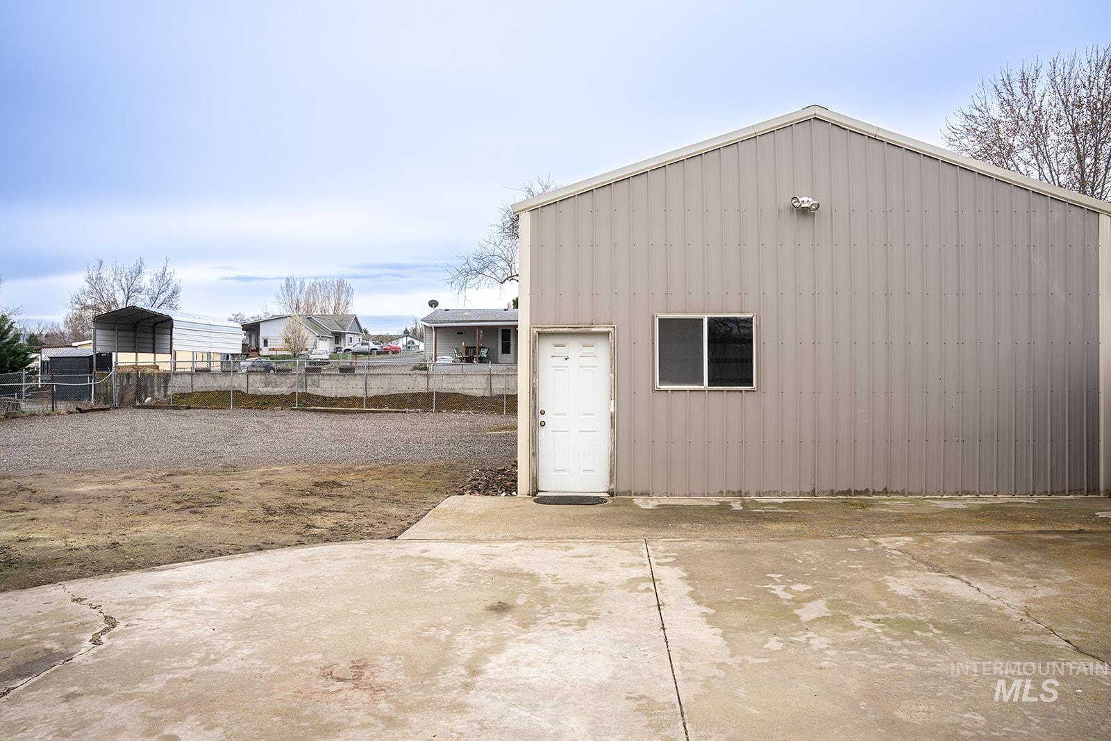 1357 Pound Lane Clarkston, WA 99403 - Photo 12 of 38 View of outbuilding with a carport and driveway