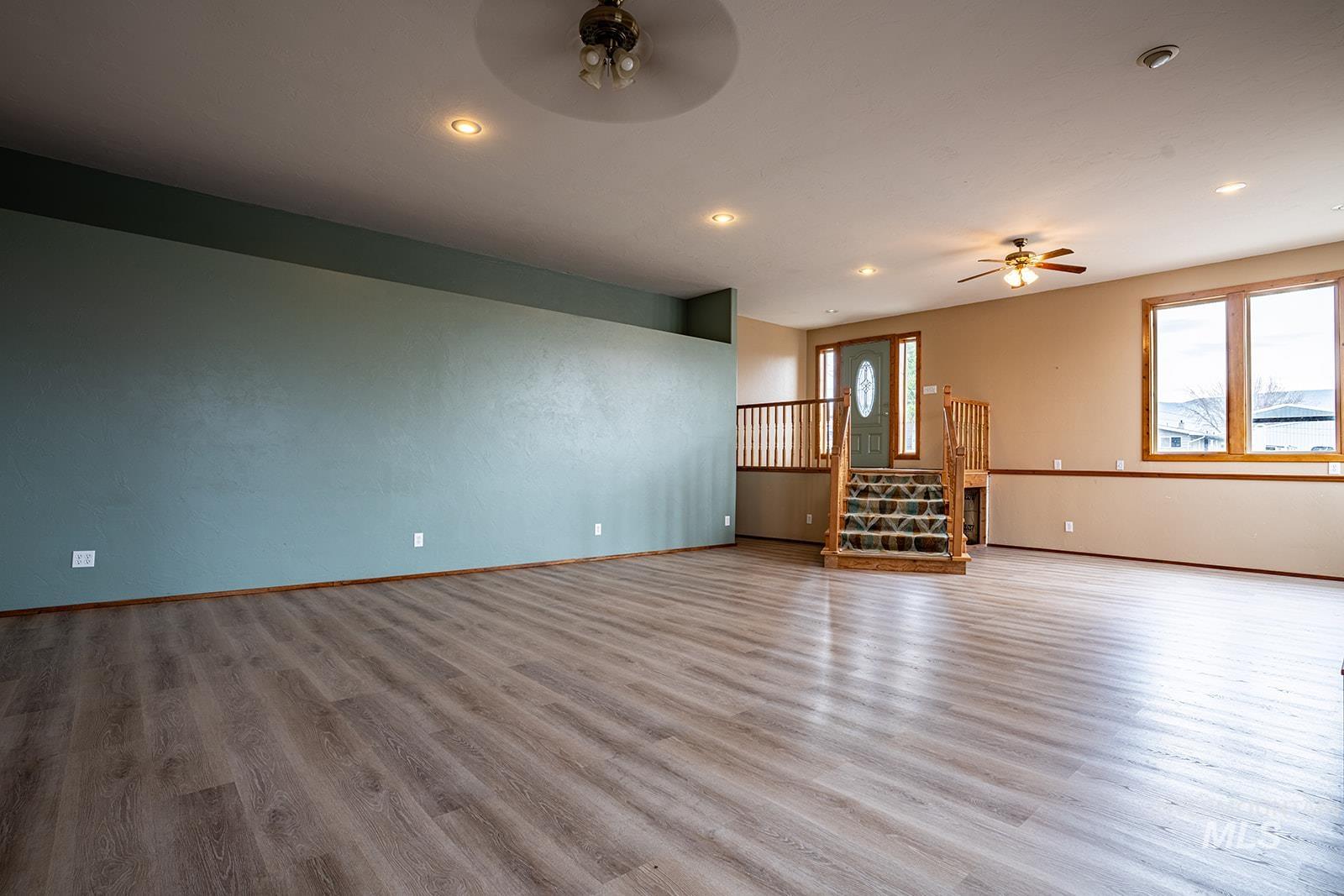1357 Pound Lane Clarkston, WA 99403 - Photo 14 of 38 Unfurnished living room with ceiling fan, light wood-style floors, healthy amount of natural light, and recessed lighting