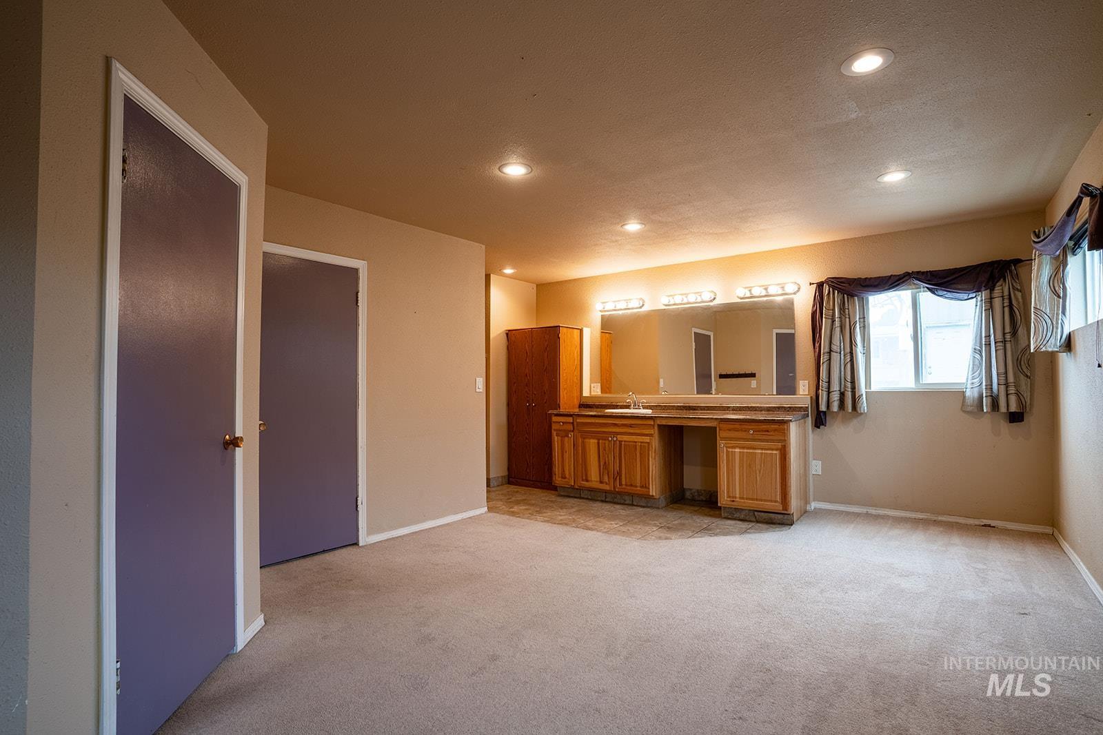 1357 Pound Lane Clarkston, WA 99403 - Photo 21 of 38 Unfurnished bedroom with recessed lighting and light carpet