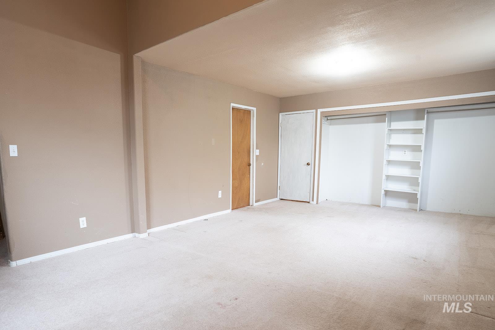 1357 Pound Lane Clarkston, WA 99403 - Photo 30 of 38 Unfurnished bedroom featuring light colored carpet and a closet