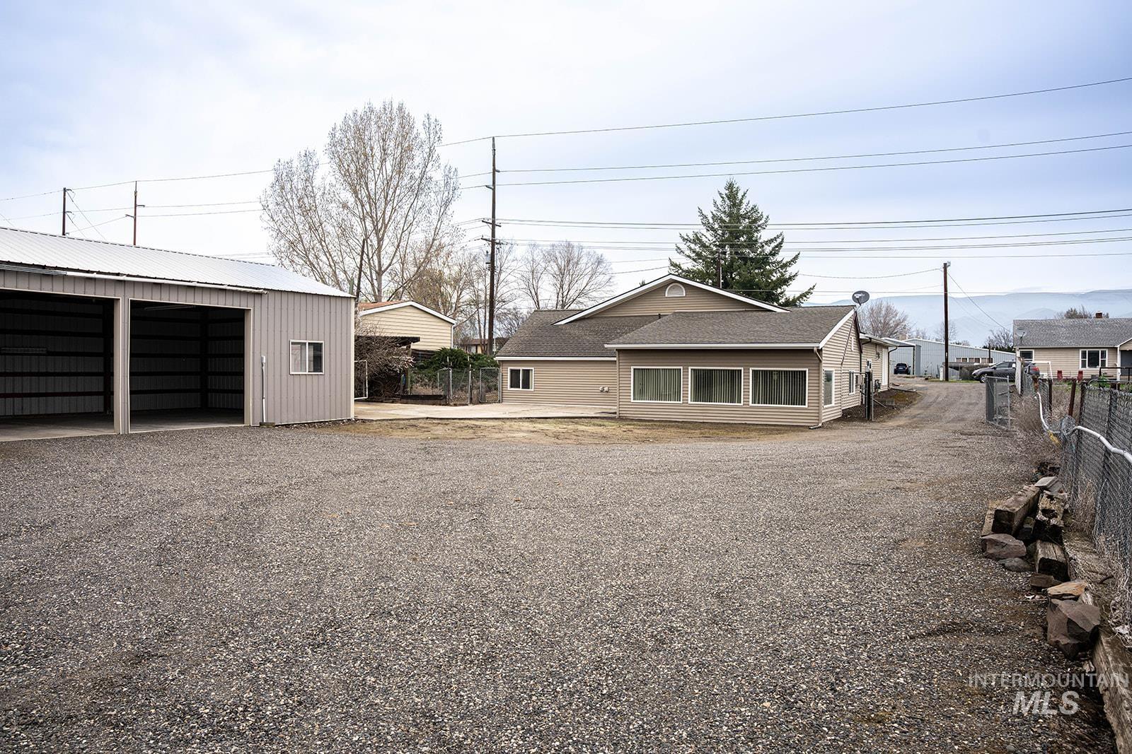 1357 Pound Lane Clarkston, WA 99403 - Photo 8 of 38 View of front of home featuring an outbuilding, a garage, and a metal roof