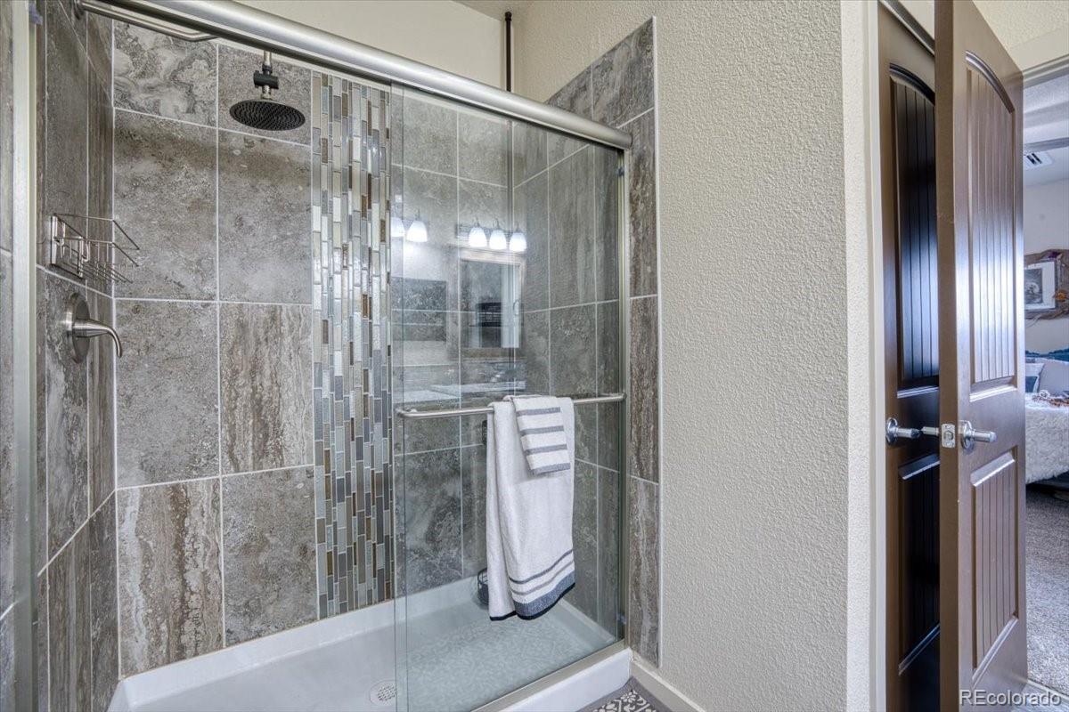 1215 North Yoder Road Yoder, CO 80864 - Photo 23 of 37 a bathroom with a shower