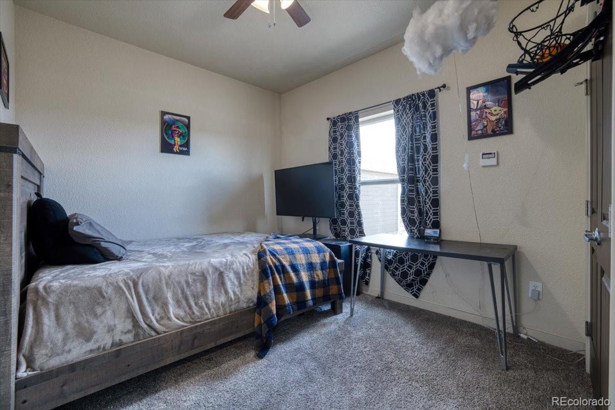 1215 North Yoder Road Yoder, CO 80864 - Photo 26 of 37 a bedroom with a bed and window