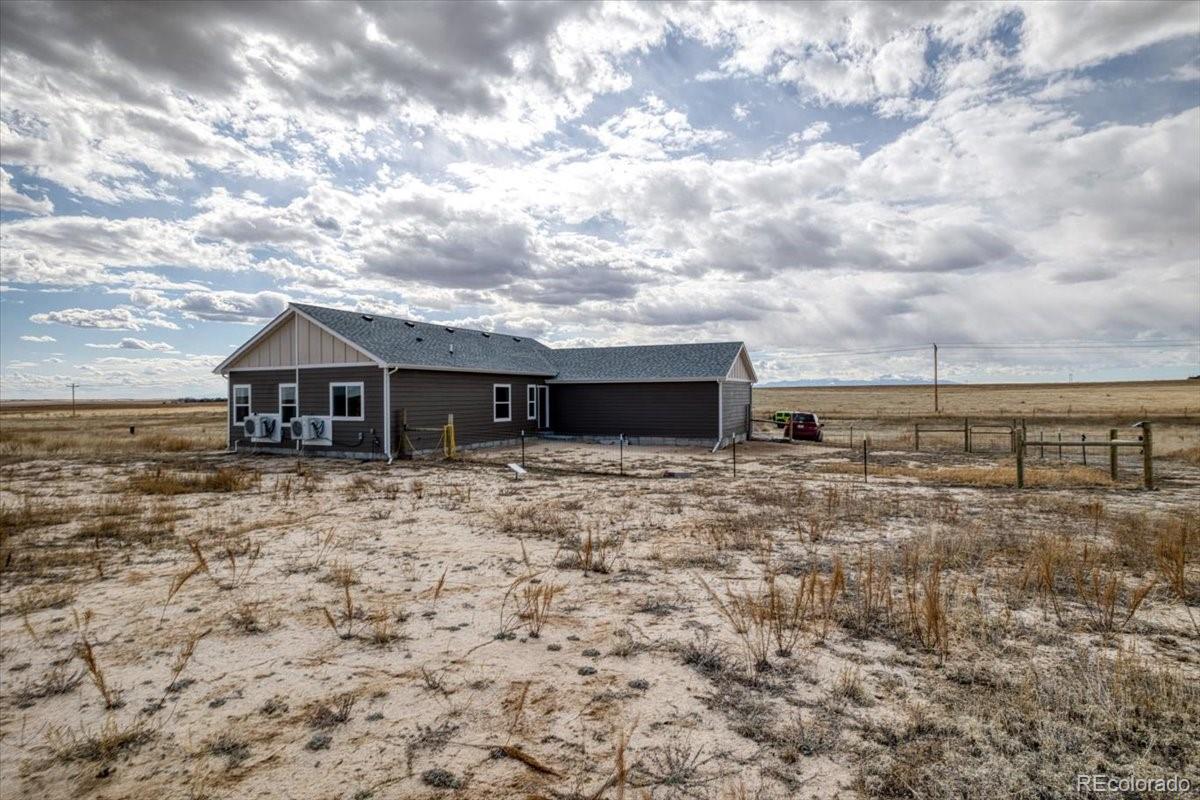 1215 North Yoder Road Yoder, CO 80864 - Photo 30 of 37 a view of house with backyard and deck
