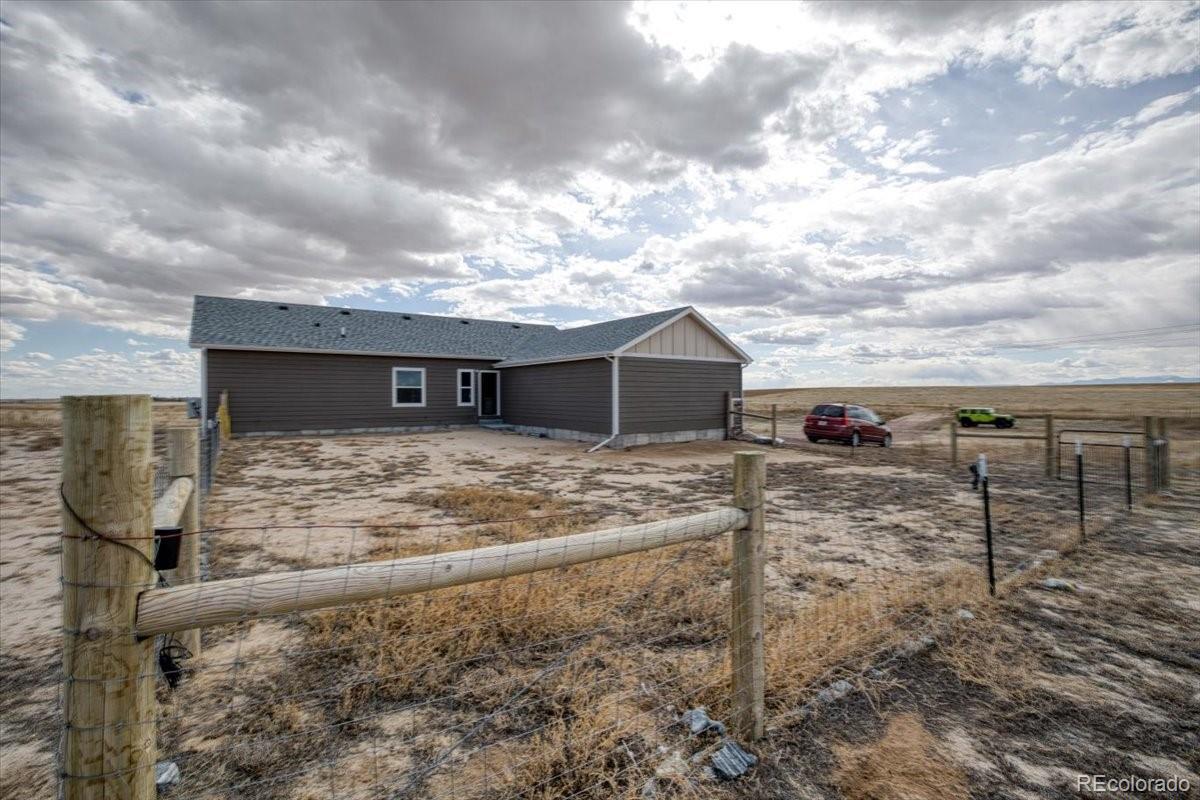 1215 North Yoder Road Yoder, CO 80864 - Photo 31 of 37 a view of a house with backyard