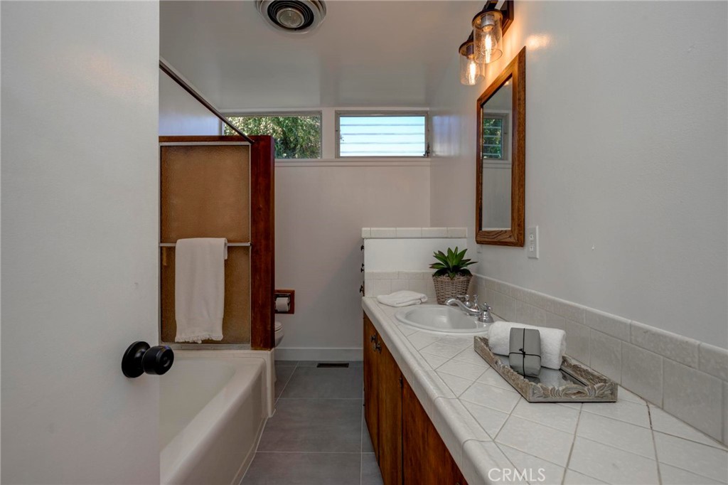 4612 Beauvais Road Rancho Palos Verdes, CA 90275 - Photo 29 of 40 a bathroom with a sink and a mirror