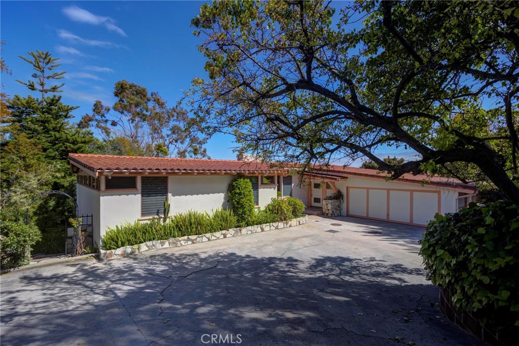 4612 Beauvais Road Rancho Palos Verdes, CA 90275 - Photo 3 of 40 a view of a house with a tree in front of it