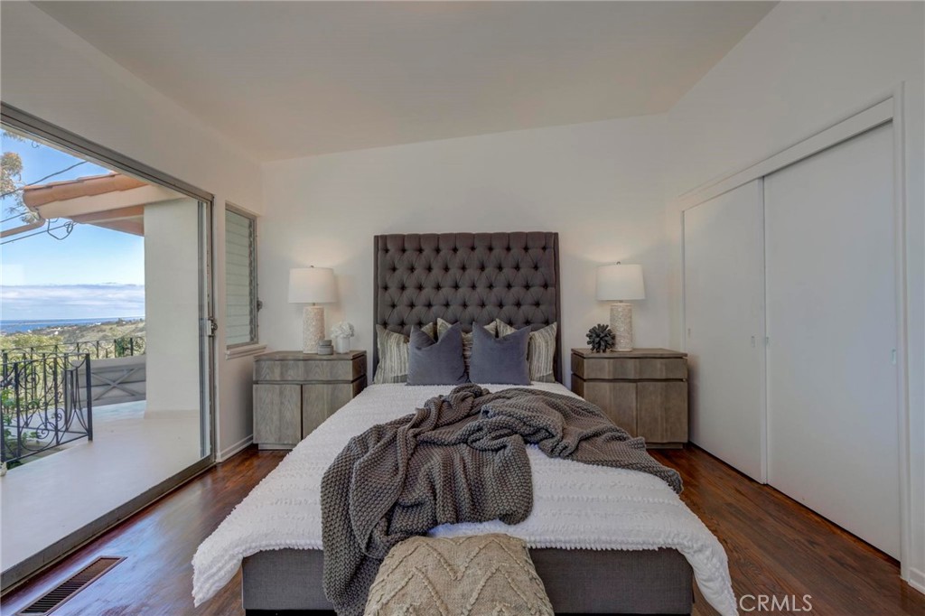 4612 Beauvais Road Rancho Palos Verdes, CA 90275 - Photo 31 of 40 a bedroom with a bed and wooden floor