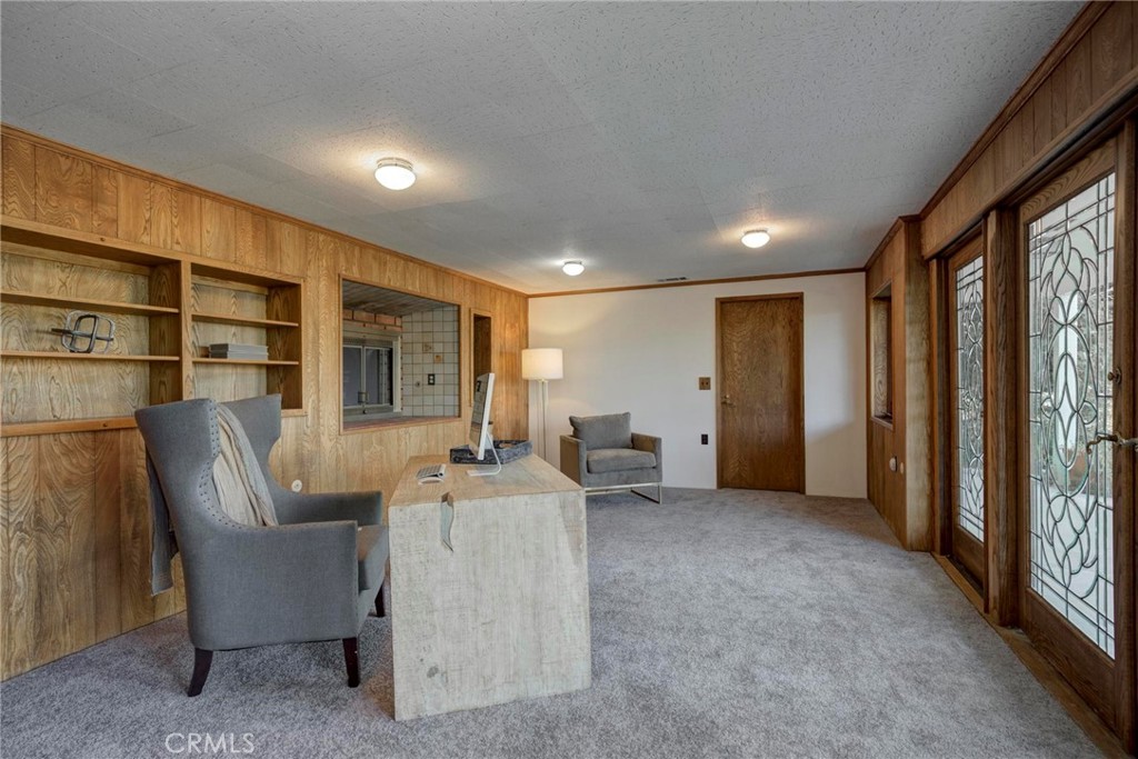 4612 Beauvais Road Rancho Palos Verdes, CA 90275 - Photo 35 of 40 a living room with furniture a flat screen tv and a large window