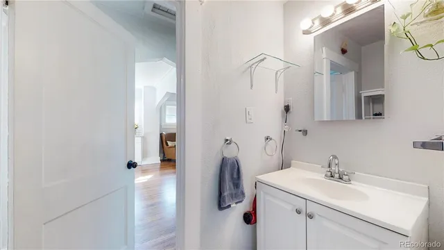 a bathroom with a sink and mirror