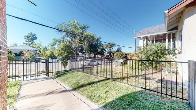 a view of a chair and table in the backyard