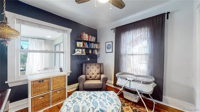 a bedroom with furniture and a window