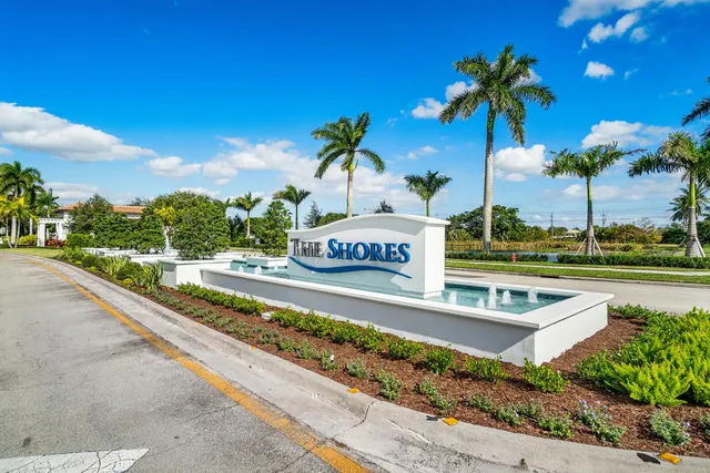 a view of a swimming pool with a patio and a yard