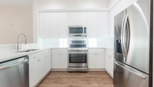 a kitchen with a refrigerator and a sink